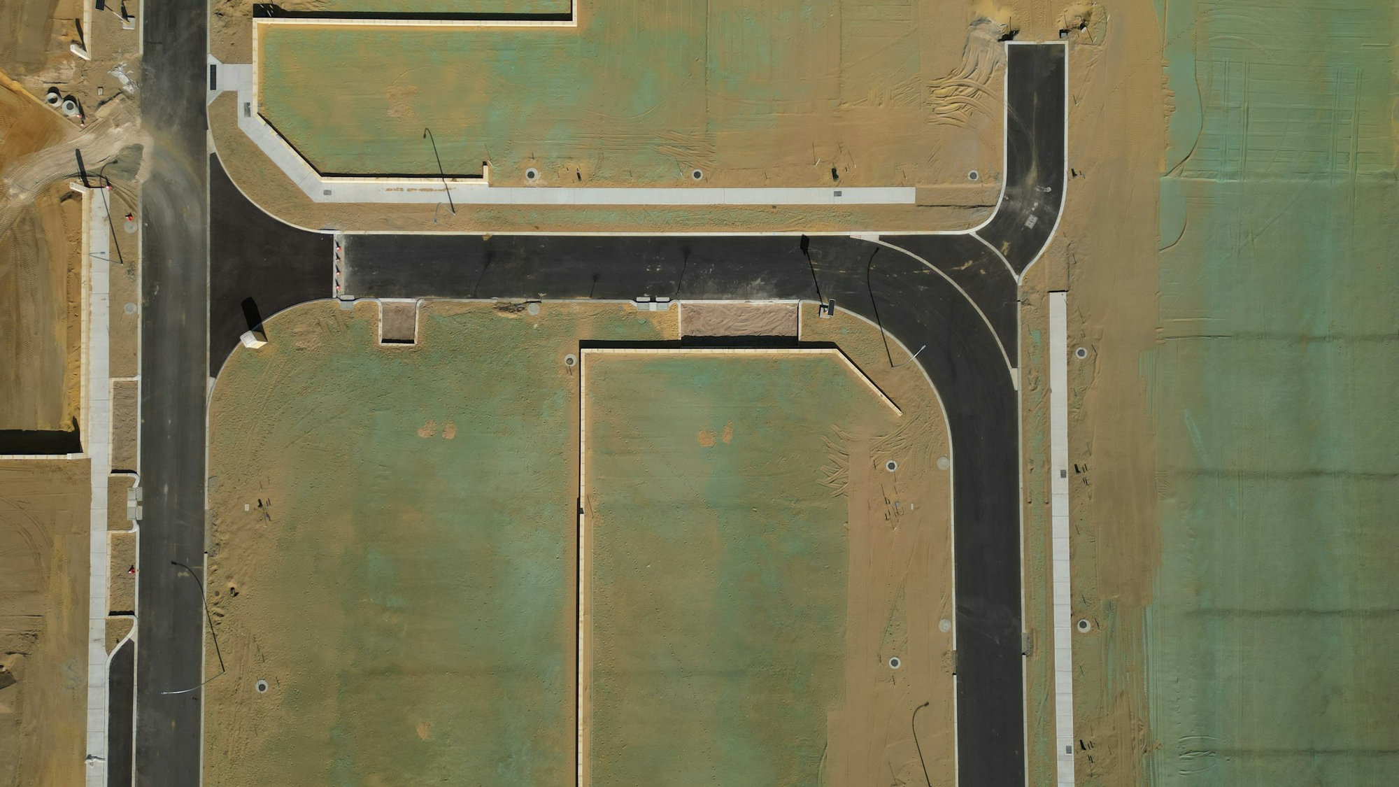 Aerial view of new subdivision streets being built on open land