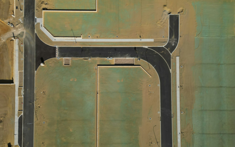 Aerial view of new subdivision streets being built on open land
