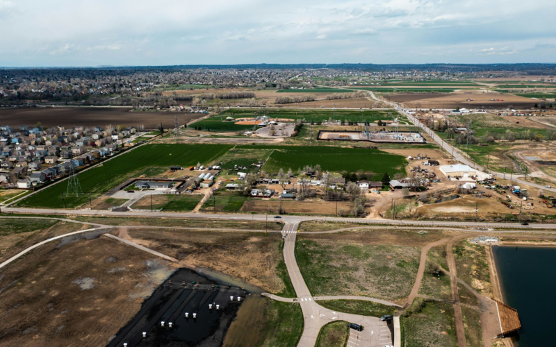 Aerial view of new housing at the edge of farmland